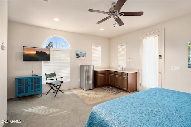 bedroom with ceiling fan, recessed lighting, light carpet, a sink, and freestanding refrigerator