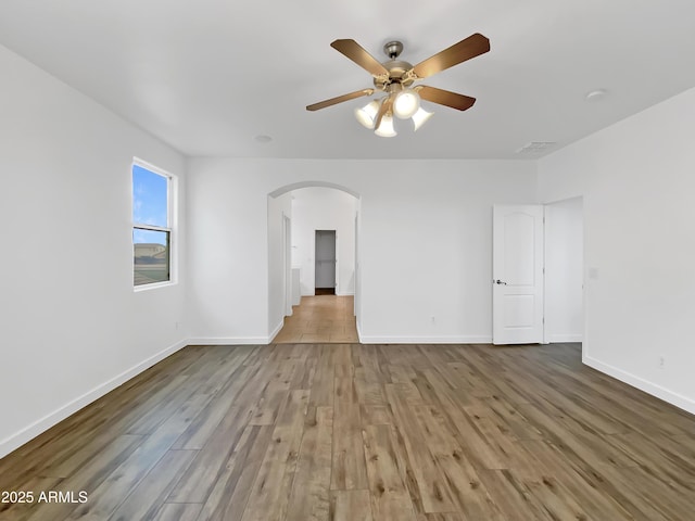 spare room with ceiling fan and light hardwood / wood-style floors