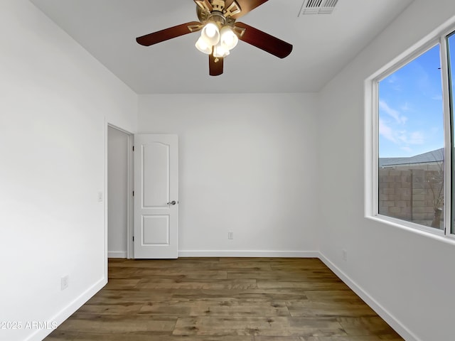 unfurnished room with wood-type flooring