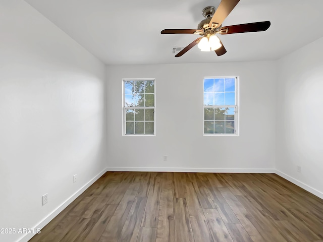 unfurnished room featuring ceiling fan and hardwood / wood-style floors