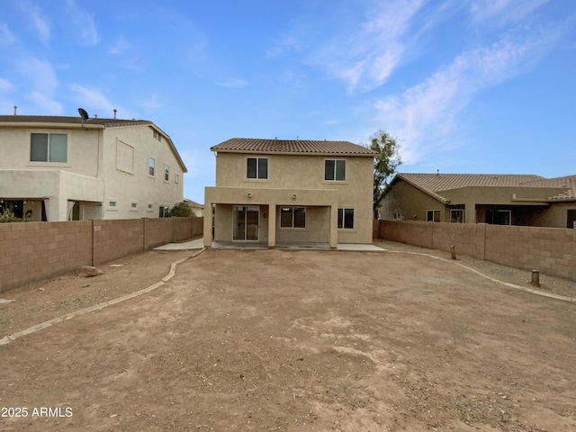 back of property with a patio area