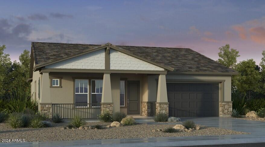 view of front of property with a porch and a garage