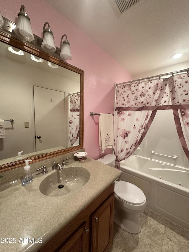 full bathroom featuring vanity, toilet, and shower / bath combo