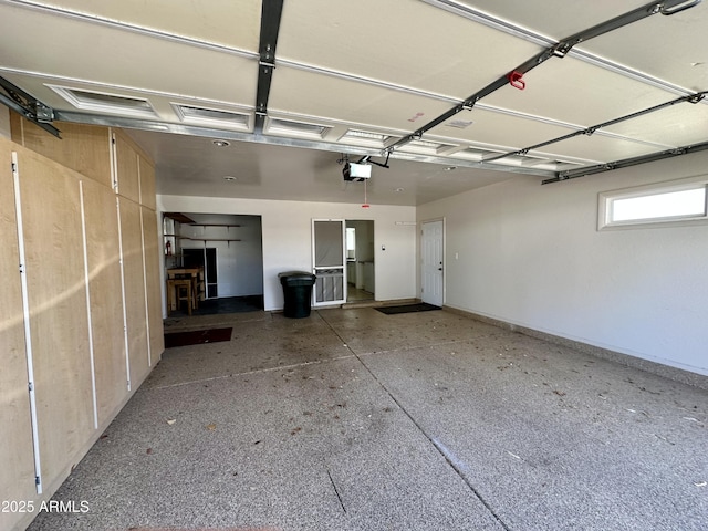 garage featuring a garage door opener