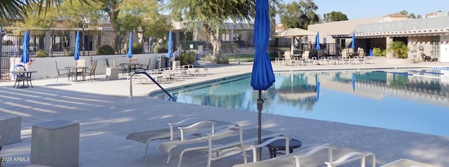 view of swimming pool featuring a patio area