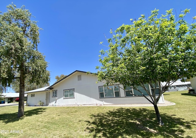 exterior space with a front lawn