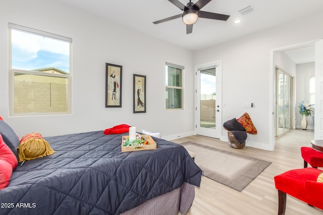 bedroom with recessed lighting, visible vents, baseboards, and wood finished floors