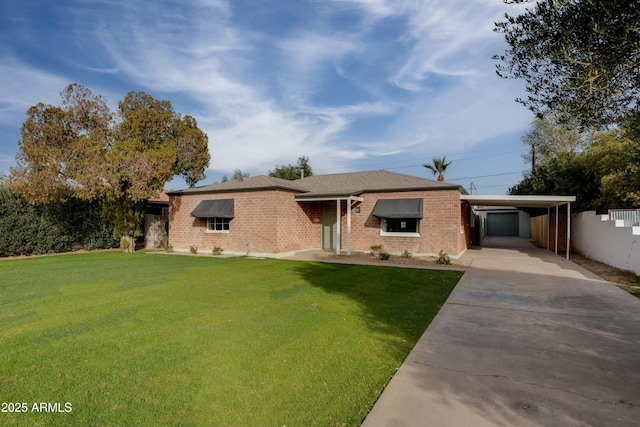 ranch-style home featuring a front lawn and a carport