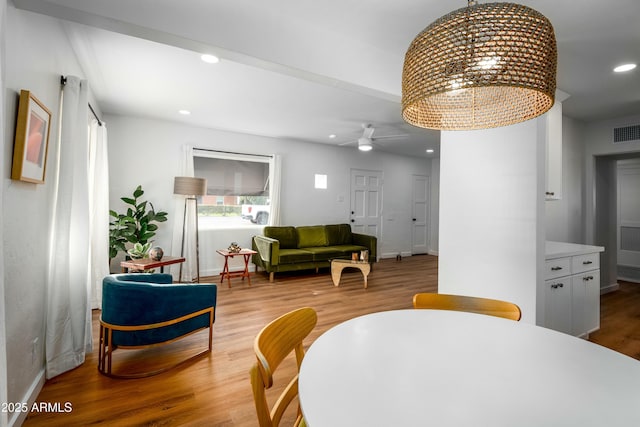 dining space featuring light hardwood / wood-style flooring and ceiling fan