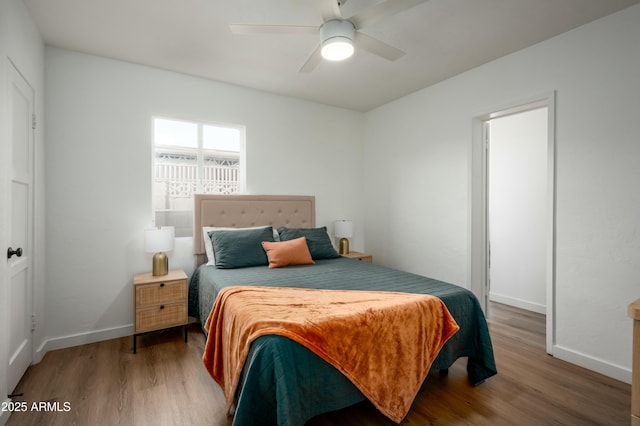 bedroom featuring hardwood / wood-style flooring and ceiling fan