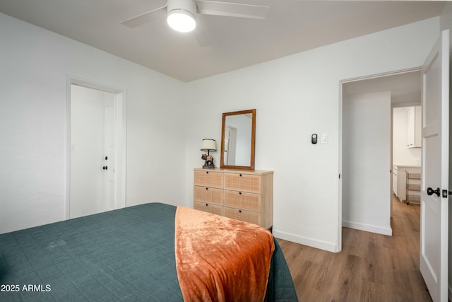 bedroom featuring ceiling fan and light hardwood / wood-style flooring