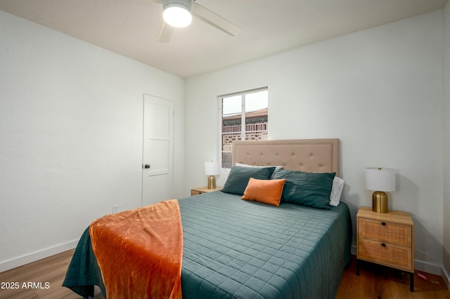 bedroom featuring dark wood-type flooring and ceiling fan