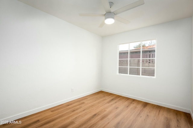 unfurnished room featuring light hardwood / wood-style flooring and ceiling fan