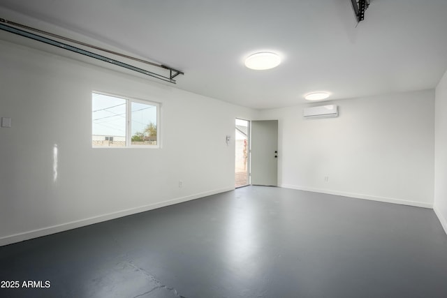 garage featuring a wall unit AC