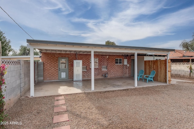 rear view of property featuring a patio area