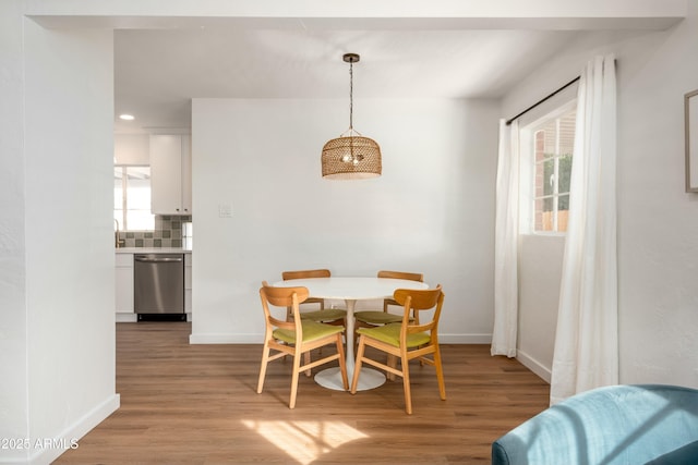 dining space featuring light hardwood / wood-style floors