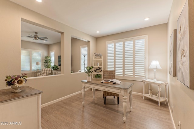 16417 W Piccadilly Rd, Goodyear, AZ 85395 - home office with baseboards, light wood finished floors, plenty of natural light, and recessed lighting