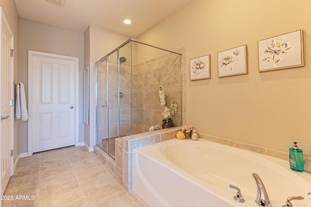 16417 W Piccadilly Rd, Goodyear, AZ 85395 - bathroom featuring a garden tub, a stall shower, and recessed lighting