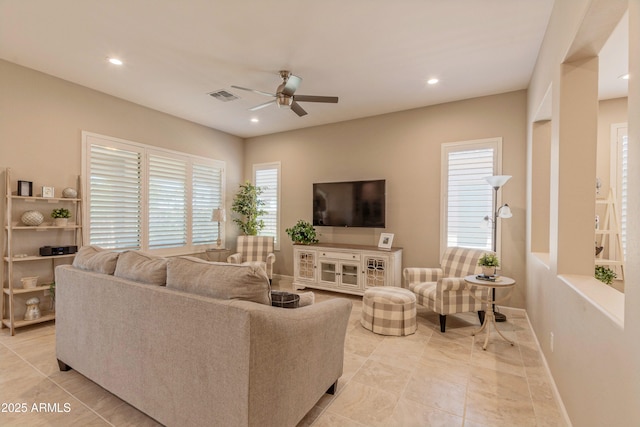 16417 W Piccadilly Rd, Goodyear, AZ 85395 - living room with ceiling fan, recessed lighting, baseboards, and light tile patterned floors