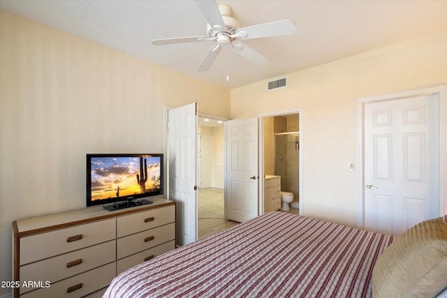 bedroom with ensuite bathroom and ceiling fan