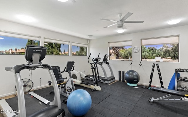 exercise room with ceiling fan