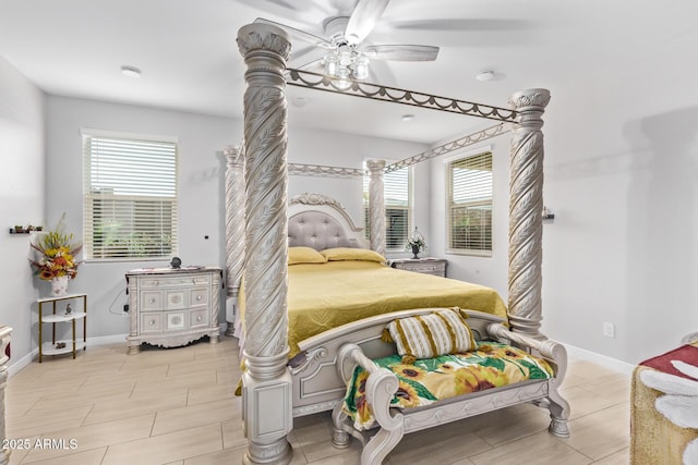 bedroom with ceiling fan and multiple windows