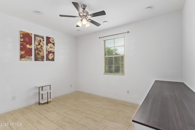 spare room with ceiling fan