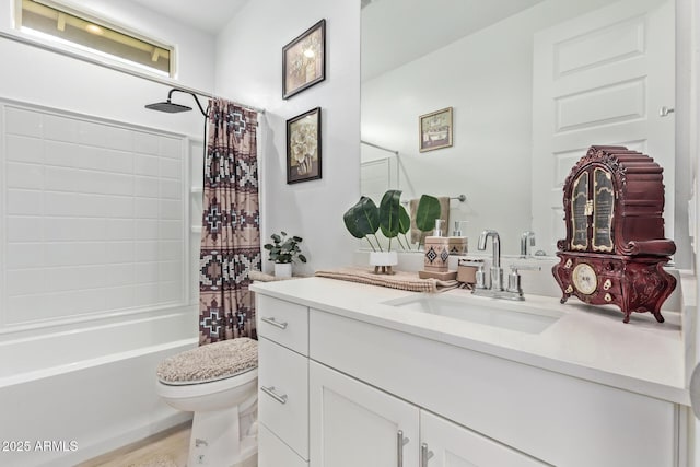 full bathroom with vanity, shower / tub combo, and toilet