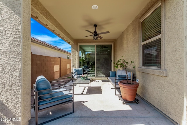 view of patio with outdoor lounge area and ceiling fan