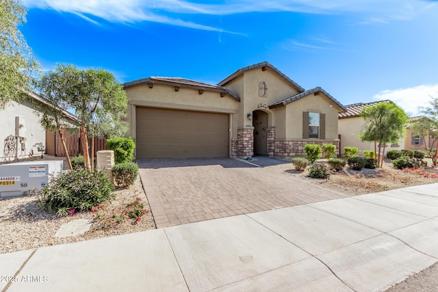 mediterranean / spanish-style home with a garage