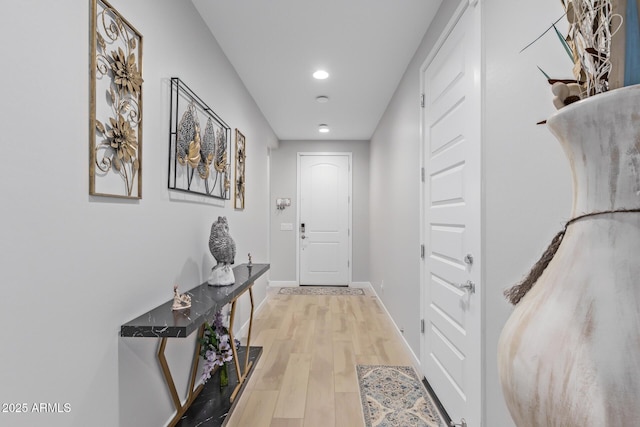 corridor featuring light hardwood / wood-style flooring