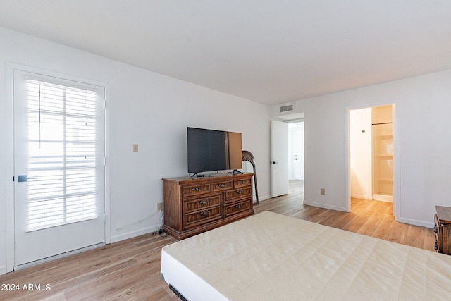 bedroom featuring visible vents, baseboards, and light wood-type flooring