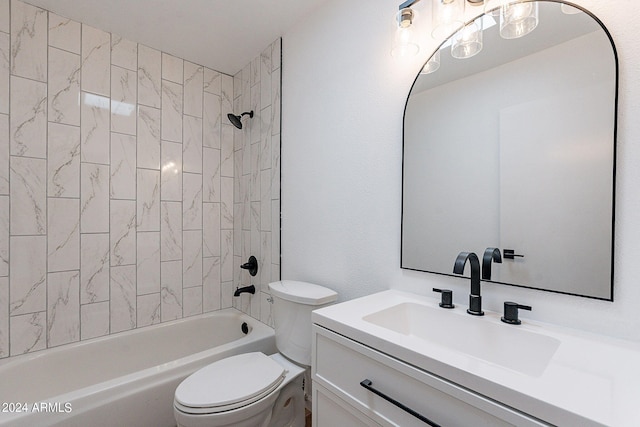 full bathroom with tiled shower / bath, vanity, and toilet