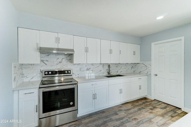 kitchen featuring white cabinetry, sink, dark wood-type flooring, and electric stove