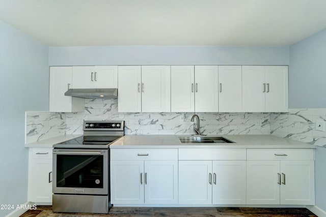 kitchen with white cabinetry, sink, backsplash, and electric stove