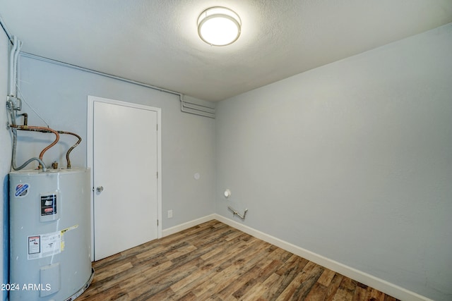 interior space featuring water heater and hardwood / wood-style flooring