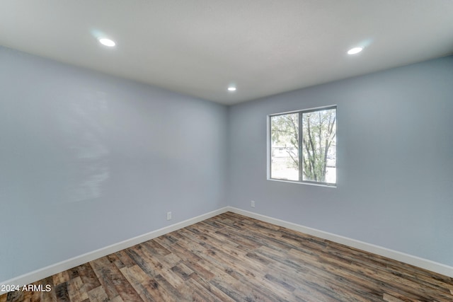 unfurnished room featuring dark hardwood / wood-style floors