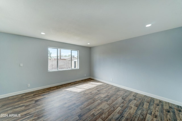 unfurnished room featuring dark hardwood / wood-style floors