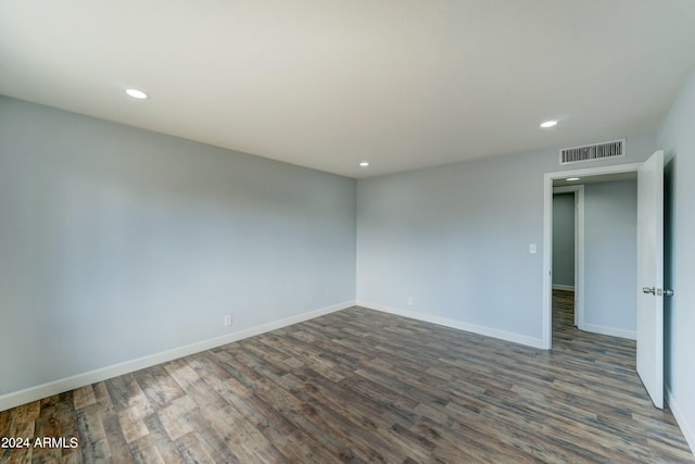 spare room featuring dark hardwood / wood-style flooring