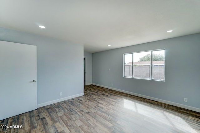 spare room with hardwood / wood-style floors