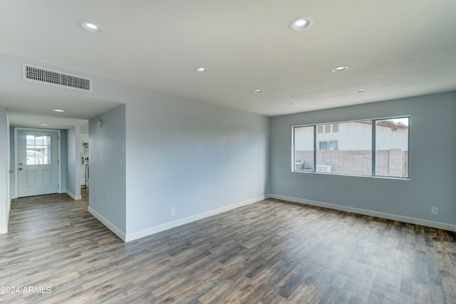 unfurnished room featuring wood-type flooring