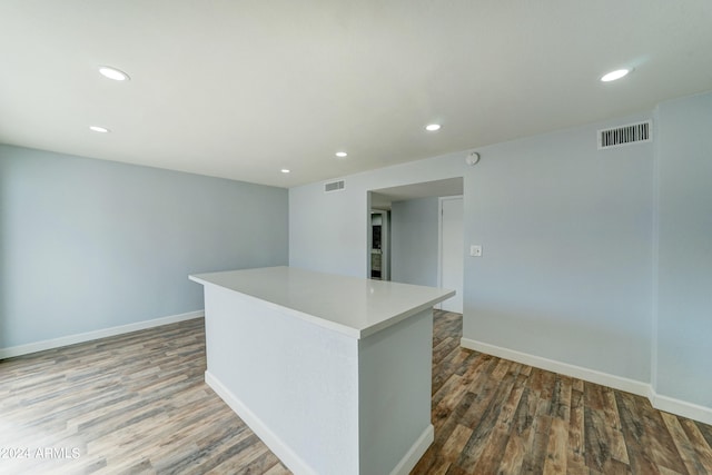 kitchen featuring a kitchen island and dark hardwood / wood-style floors