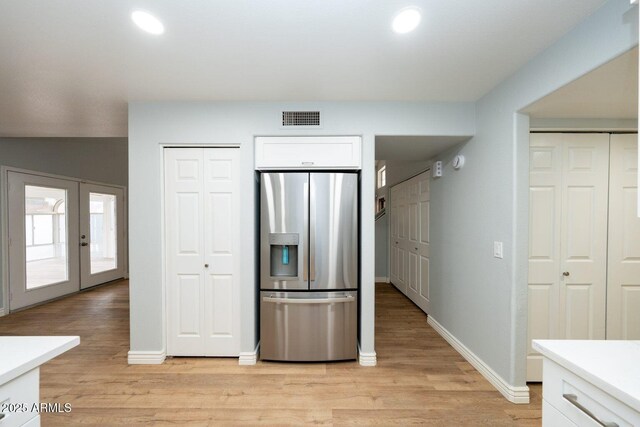909 W San Mateo Ct, Gilbert, AZ 85233 - kitchen featuring stainless steel fridge, white cabinetry, light wood-style flooring, light countertops, and recessed lighting