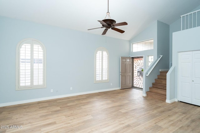 909 W San Mateo Ct, Gilbert, AZ 85233 - foyer featuring a ceiling fan, light wood finished floors, stairway, high vaulted ceiling, and baseboards