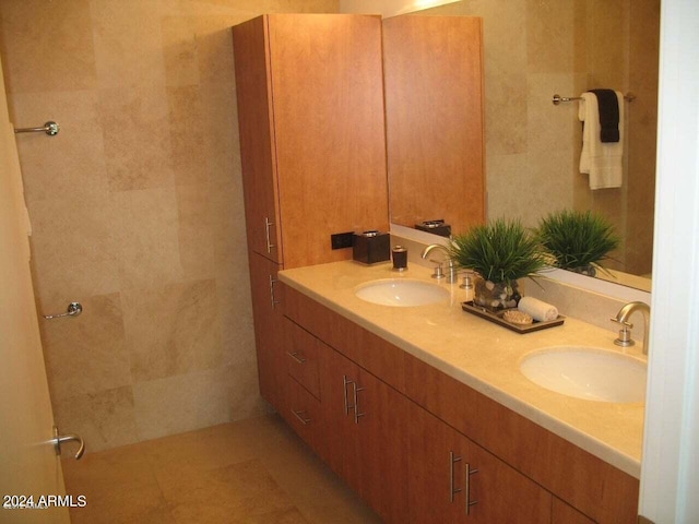 bathroom featuring double vanity and tile floors