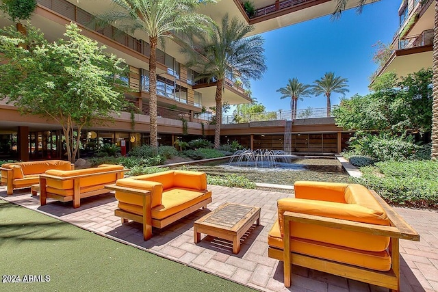 view of patio with a balcony and an outdoor living space