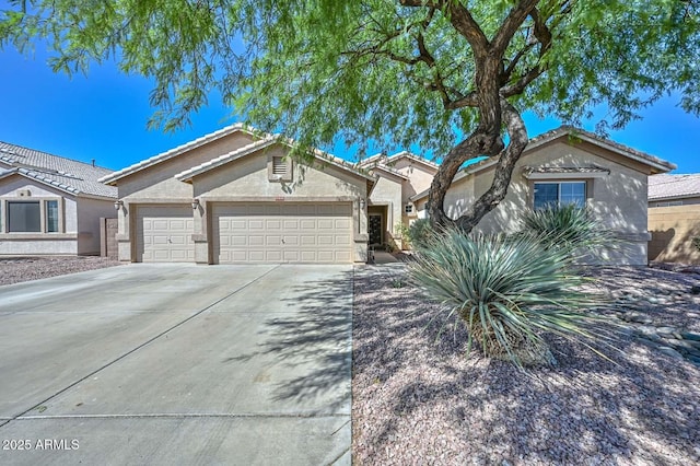 11580 N 86th Ln, Peoria, AZ 85345 - single story home featuring stucco siding, a garage, driveway, and a tiled roof