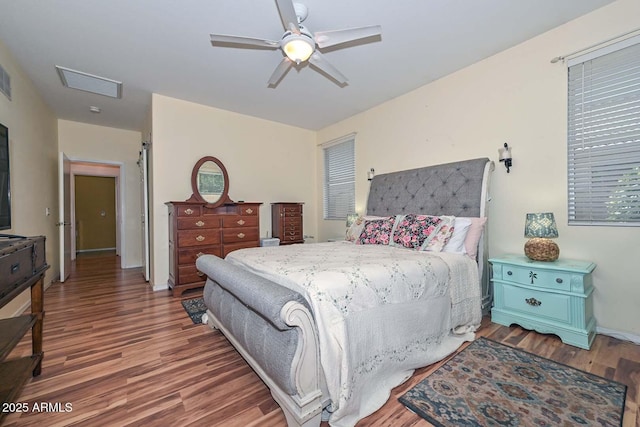 11580 N 86th Ln, Peoria, AZ 85345 - bedroom with wood finished floors and a ceiling fan