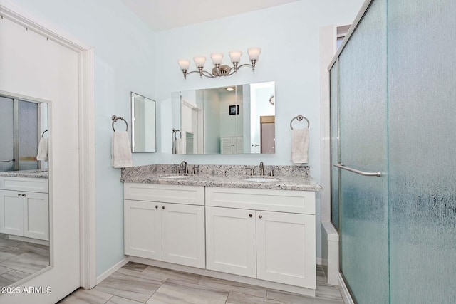11580 N 86th Ln, Peoria, AZ 85345 - full bathroom with double vanity and a stall shower