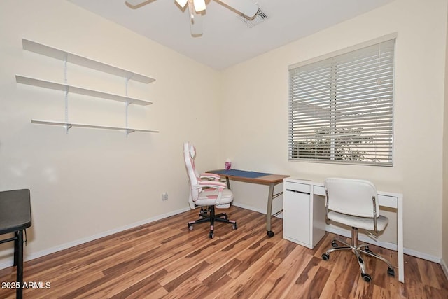 11580 N 86th Ln, Peoria, AZ 85345 - home office featuring light wood finished floors and ceiling fan